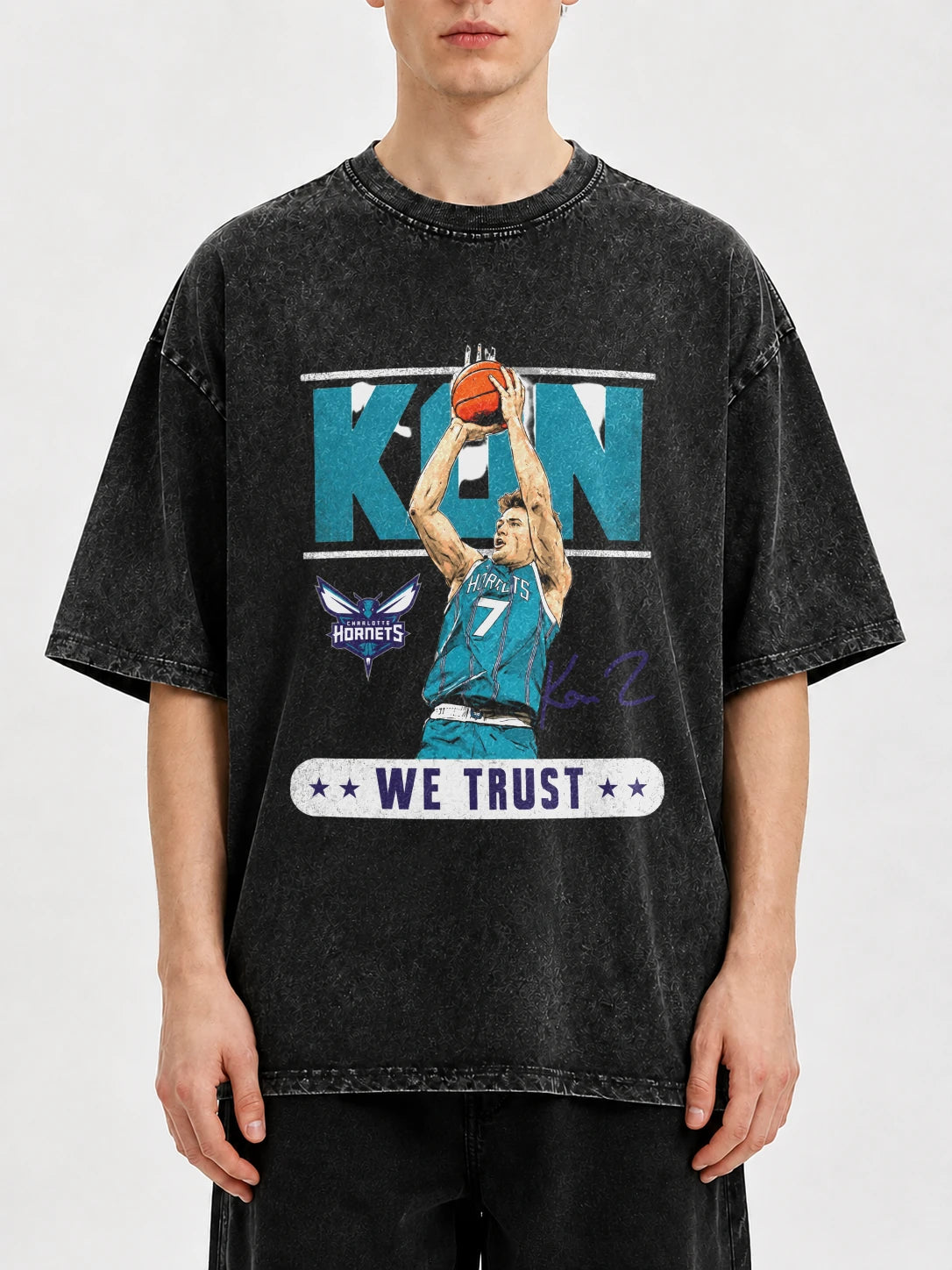 Model wearing a vintage black basketball graphic tee with a bold design
