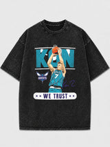 Model wearing a vintage black basketball graphic tee with a bold design