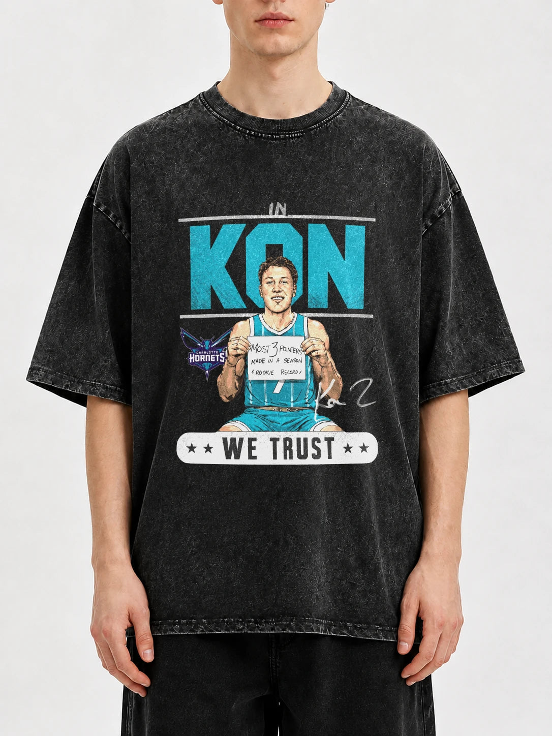 Oversized vintage graphic t-shirt in dark color featuring bold print