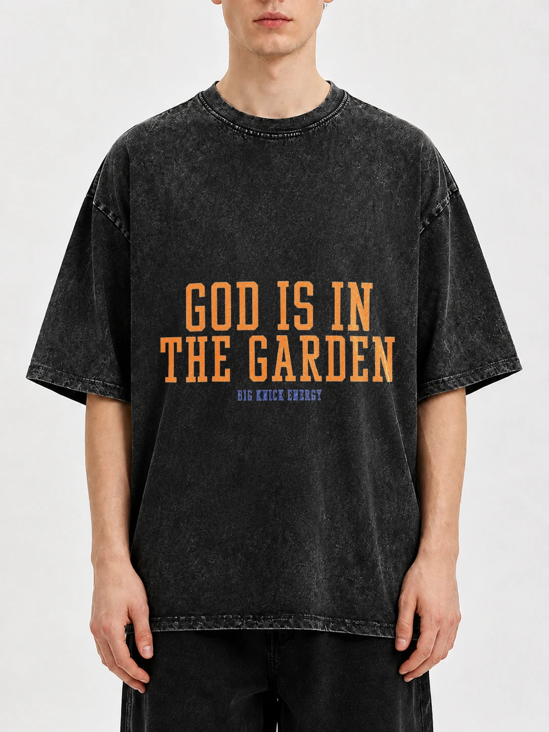 Oversized black graphic tee with 'God Is In The Garden' print